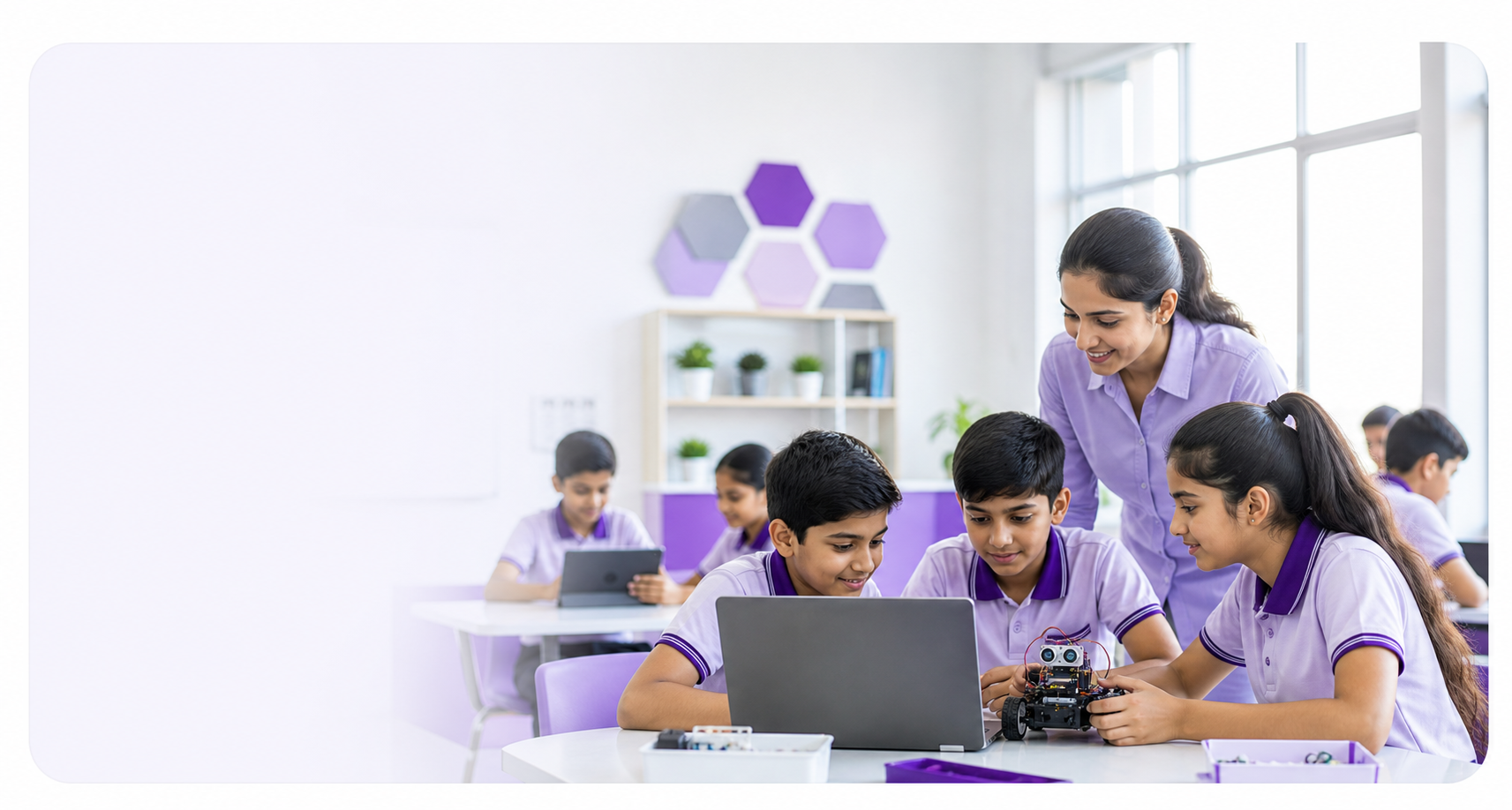 School students working with a teacher on a guided technology project